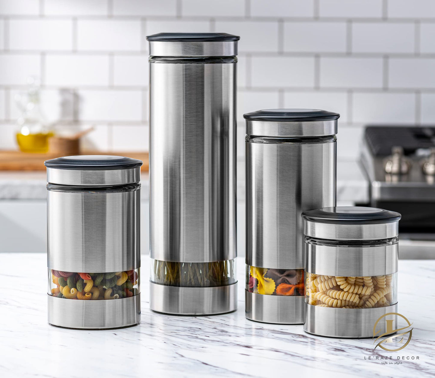 Le'raze Airtight Glass Canister Set of 4 with Stainless Steel Sleeve for Kitchen Counter - Food Storage Containers with Glass Window and Airtight Lids - Pantry Storage and Organization Set