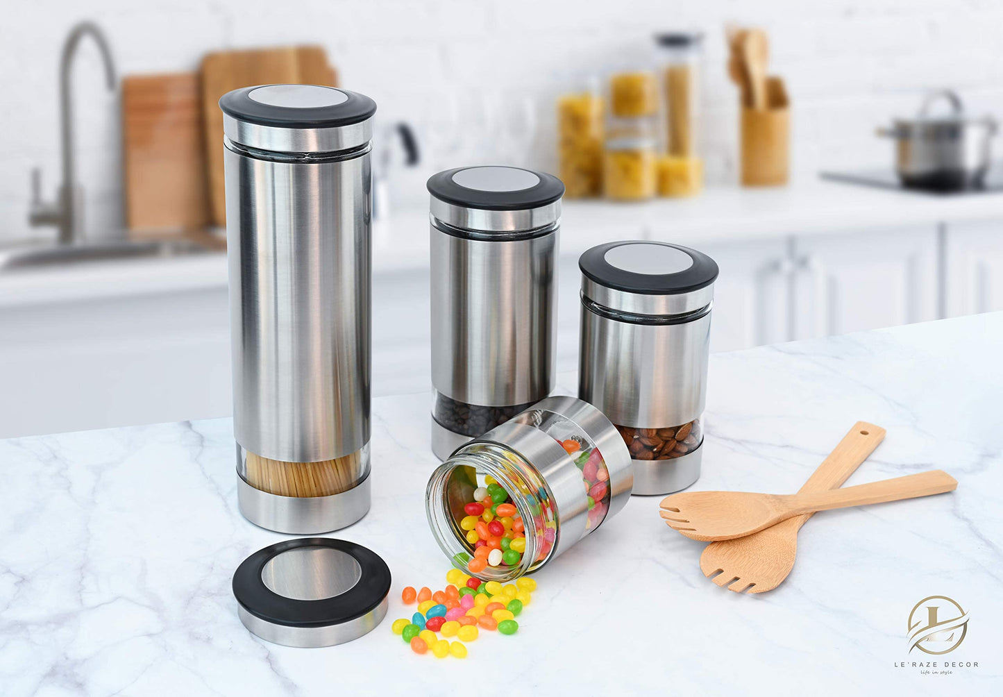 Le'raze Airtight Glass Canister Set of 4 with Stainless Steel Sleeve for Kitchen Counter - Food Storage Containers with Glass Window and Airtight Lids - Pantry Storage and Organization Set