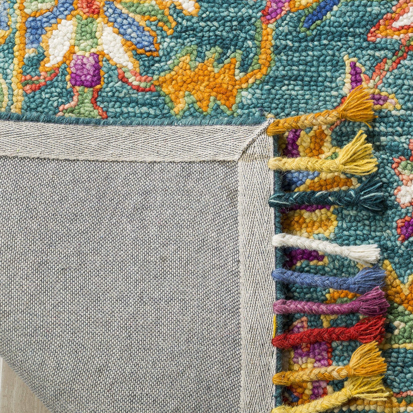 SAFAVIEH Aspen Collection Accent Rug - 2' x 3', Turquoise & Purple, Handmade Boho Braided Tassel Wool, Ideal for High Traffic Areas in Entryway, Living Room, Bedroom (APN113K)
